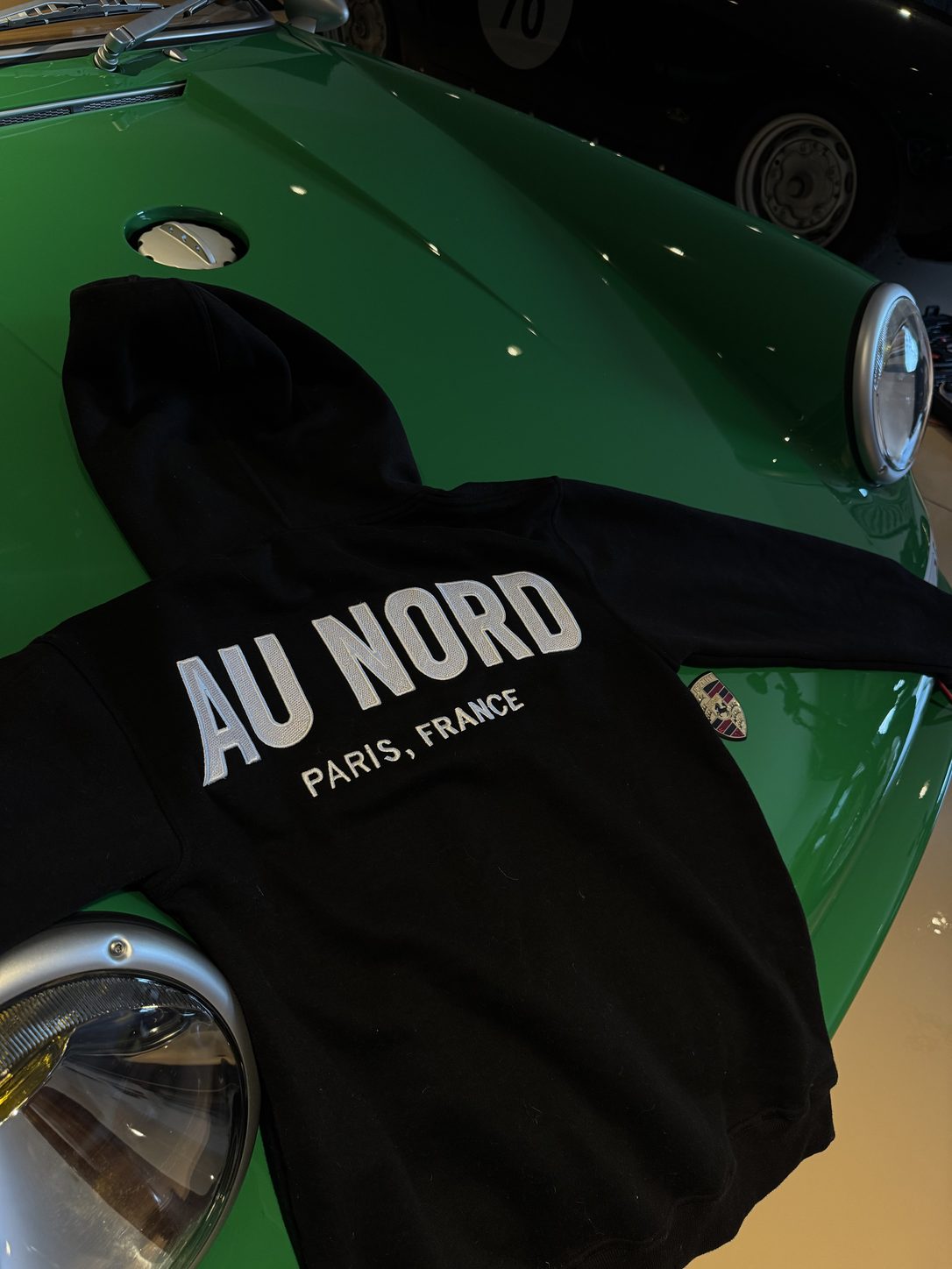 au nord hoodie — draped over the 911 fender